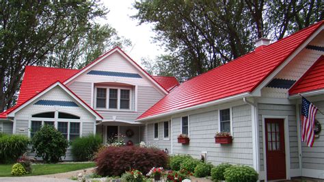 red house with siding and metal roof|red roof exterior houses.